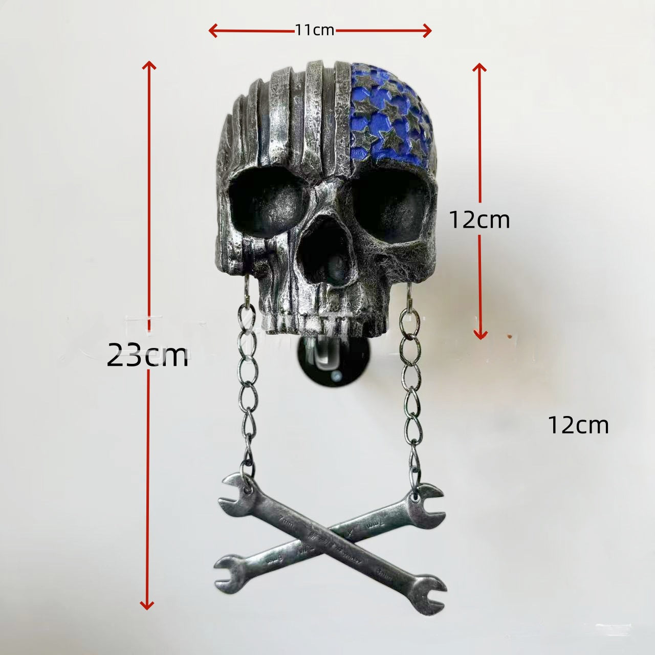 Decorative helmet holder with skull made of synthetic resin